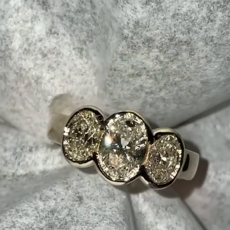 5ct Oval Cut White Sapphire Three Stone Bezel Set Yellow Gold Ring