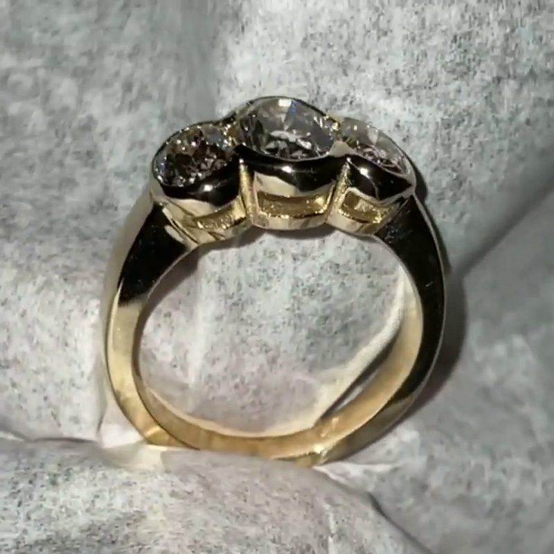 5ct Oval Cut White Sapphire Three Stone Bezel Set Yellow Gold Ring