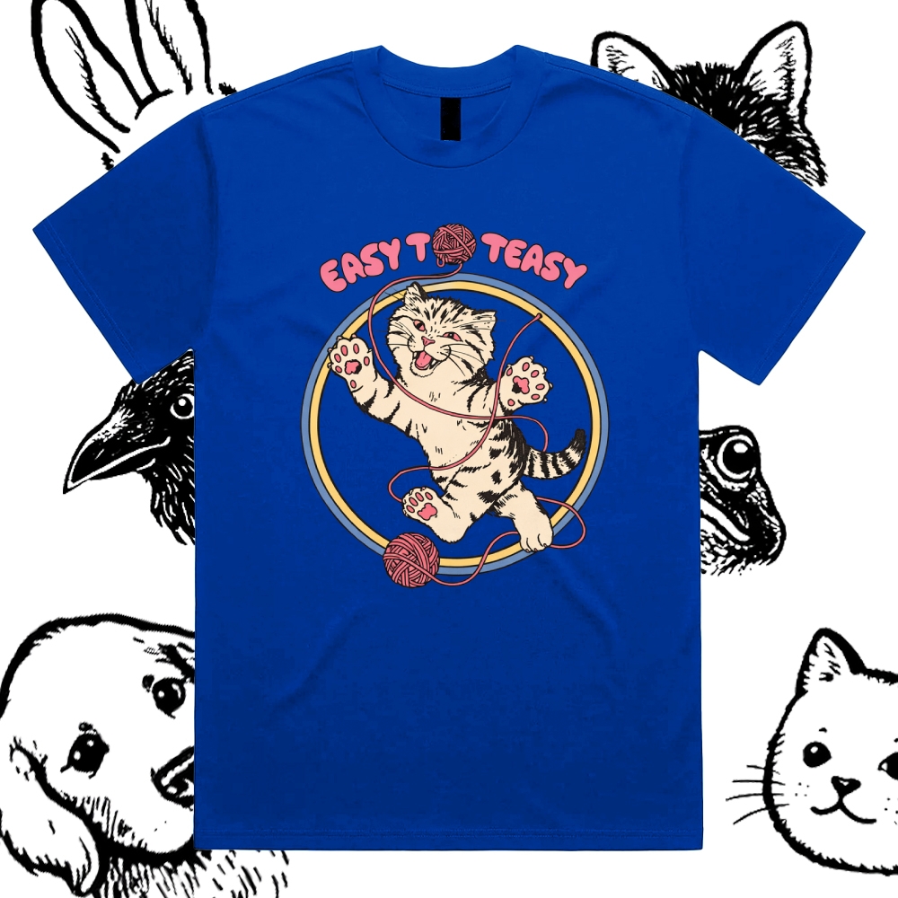 A playful “EASY To EASY” graphic tee featuring a happy kitten tangled in yarn.