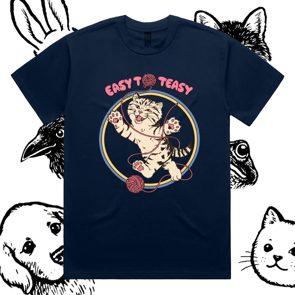 A playful “EASY To EASY” graphic tee featuring a happy kitten tangled in yarn.