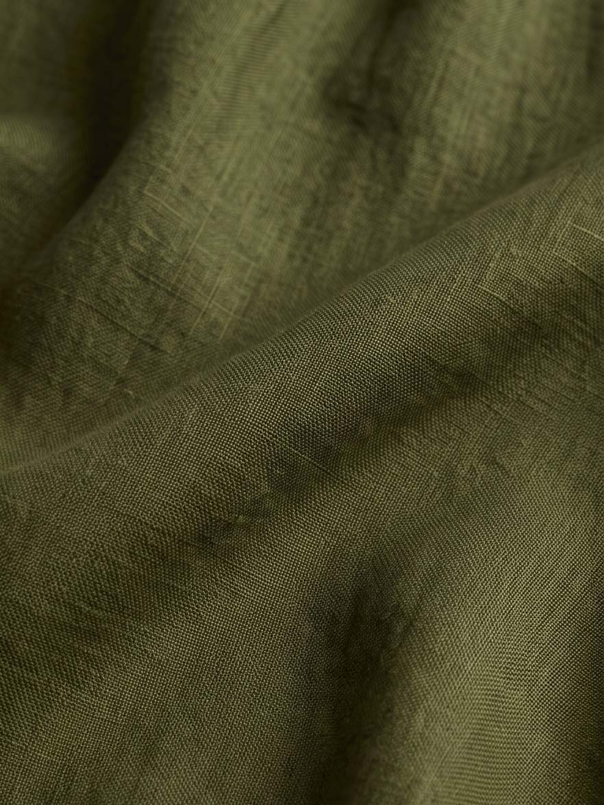 Olive skirt texture and flowing hem detail