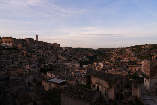 An ancient city skyline at dusk.