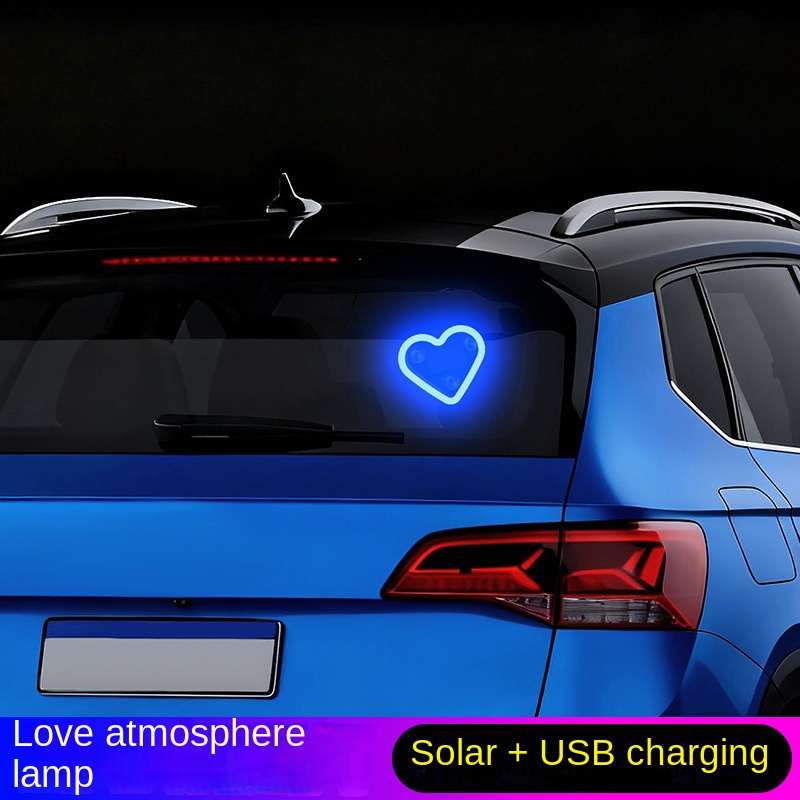 2pic: Solar-powered neon LED triangle-shaped window lights for cars, creating a loving and cozy atmosphere inside the vehicle.