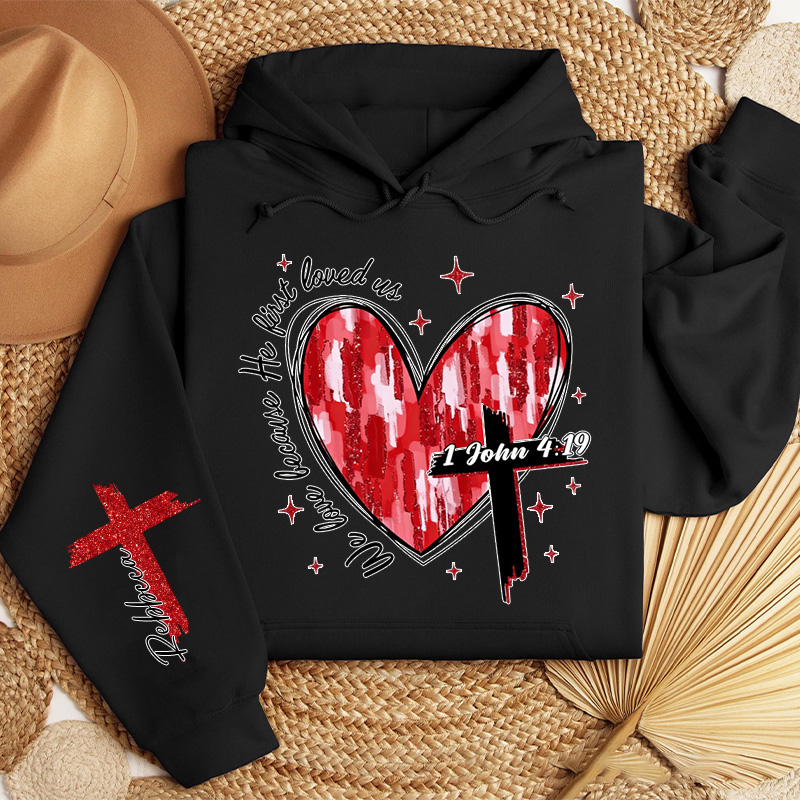 Personalized We Love Because He First Loved Us Classic Hoodies with Custom Name Heart Cross Valentine Bible Verse Hoodie Love Jesus Valentine Day Gift