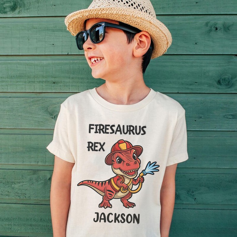 Personalized Dinosaur Firefighter Kids T-Shirt with Adorable Firesaurus Rex Graphic and Custom Name for Fun Adventures Kids T-Shirt