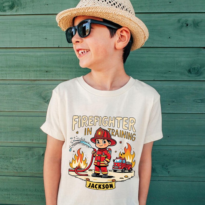 Personalized Firefighter in Training Kids T-Shirt with Custom Name and Cute Cartoon Firefighter Graphic for Aspiring Heroes Kids T-Shirt