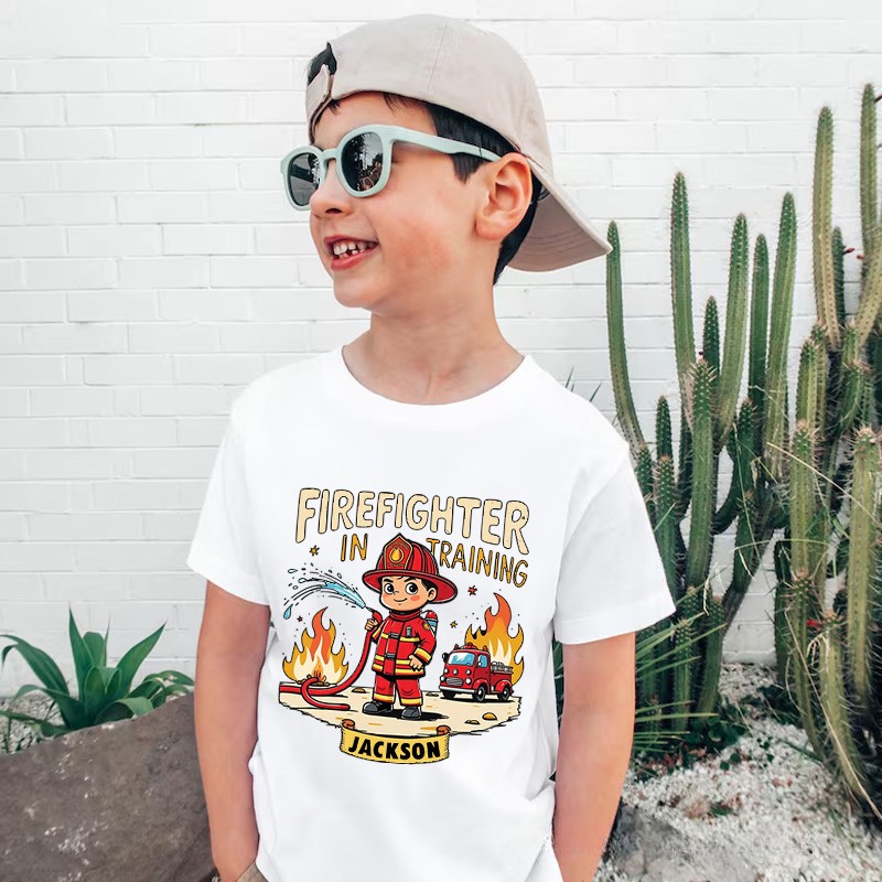 Personalized Firefighter in Training Kids T-Shirt with Custom Name and Cute Cartoon Firefighter Graphic for Aspiring Heroes Kids T-Shirt