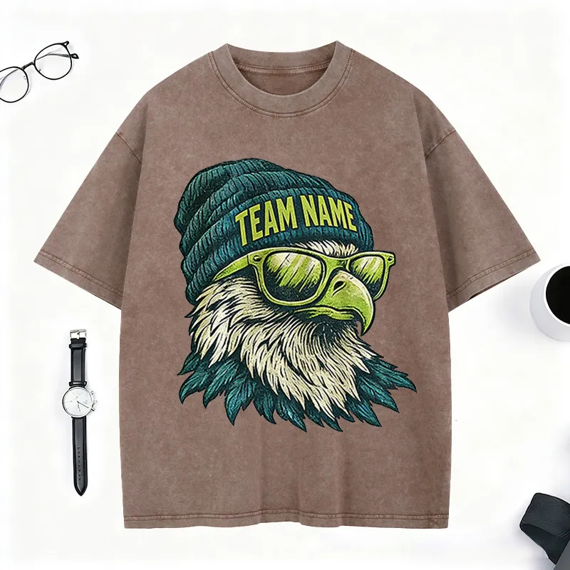 Personalized Football Mascot Washed T-Shirt with Beanie-Wearing Eagle and Custom Team Name for Football Enthusiasts