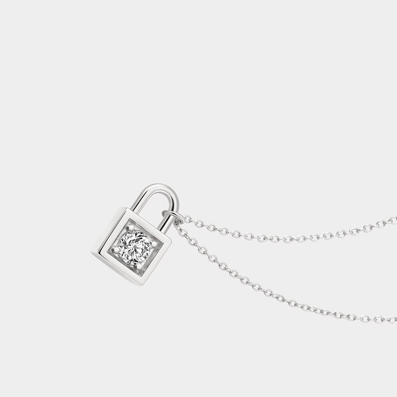 Personalized sterling silver lock necklace – customizable with engraving and a birthstone pendant.