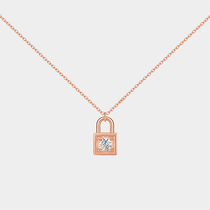Personalized sterling silver lock necklace – customizable with engraving and a birthstone pendant.