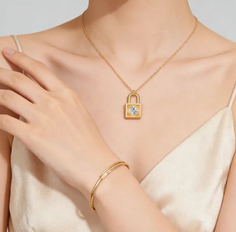 Personalized sterling silver lock necklace – customizable with engraving and a birthstone pendant.