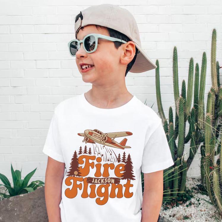 Personalized Fire Flight Kids T-Shirt with Custom Name and Retro Aerial Firefighter Plane Graphic for Little Adventurers Kids T-Shirt