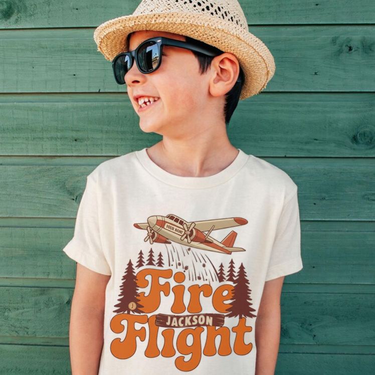 Personalized Fire Flight Kids T-Shirt with Custom Name and Retro Aerial Firefighter Plane Graphic for Little Adventurers Kids T-Shirt