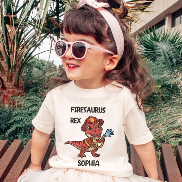Personalized Dinosaur Firefighter Kids T-Shirt with Adorable Firesaurus Rex Graphic and Custom Name for Fun Adventures Kids T-Shirt