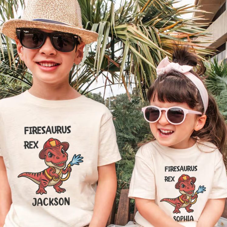 Personalized Dinosaur Firefighter Kids T-Shirt with Adorable Firesaurus Rex Graphic and Custom Name for Fun Adventures Kids T-Shirt