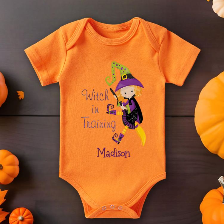 Personalized Witch in Training Featuring Adorable Witch Motif and Customizable Name for Baby’s Halloween Celebration Baby Onesie