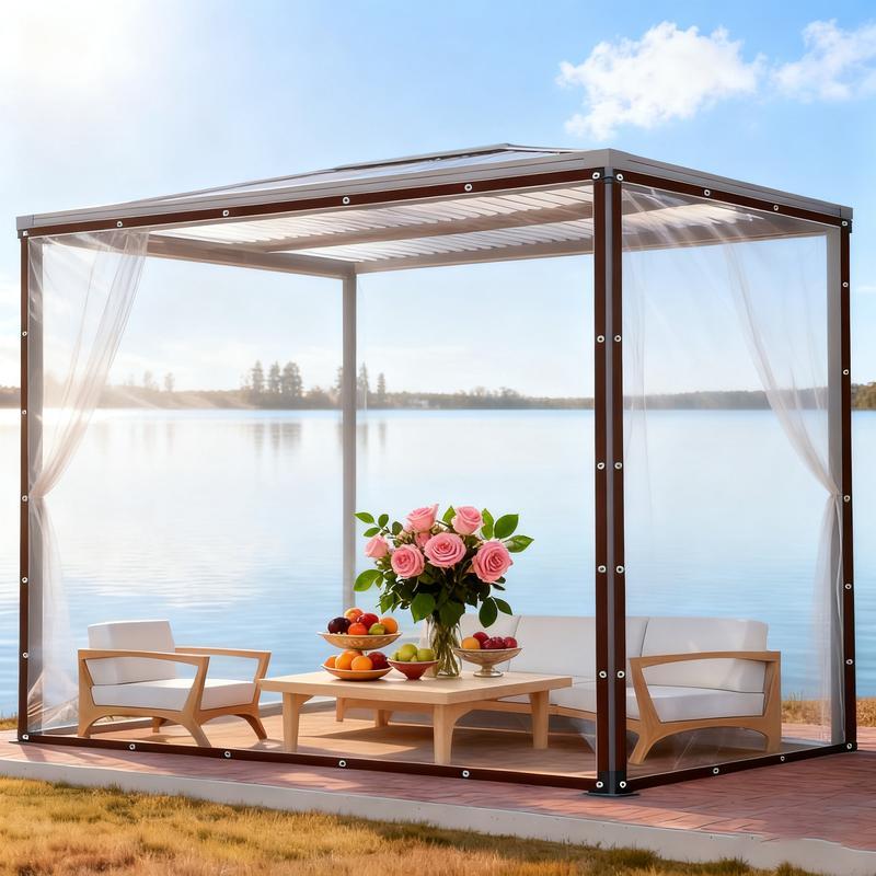 Transparent vinyl tarp covering outdoor furniture and equipment