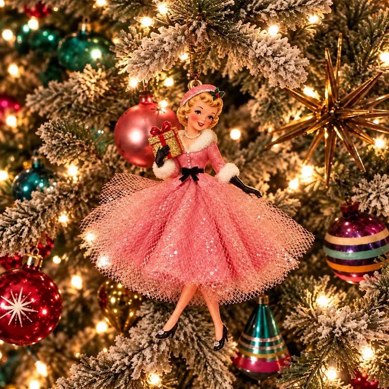 Pink vintage lady Christmas ornament hanging from a lit tree