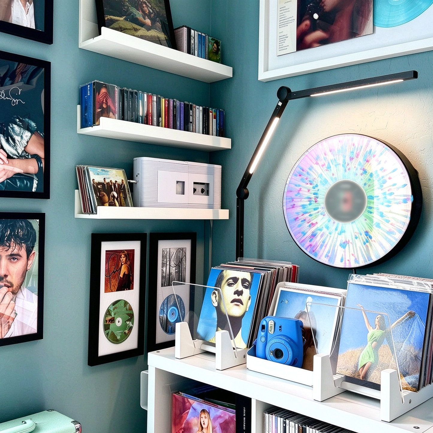 Illuminated vinyl display mounted on a wall above a record shelf