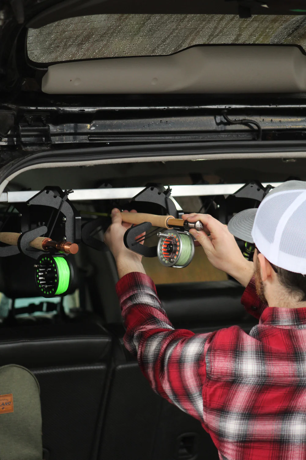 In-vehicle fishing rod storage rack