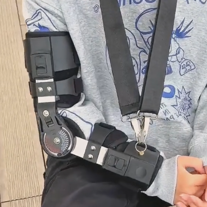 Hinged range of motion elbow brace