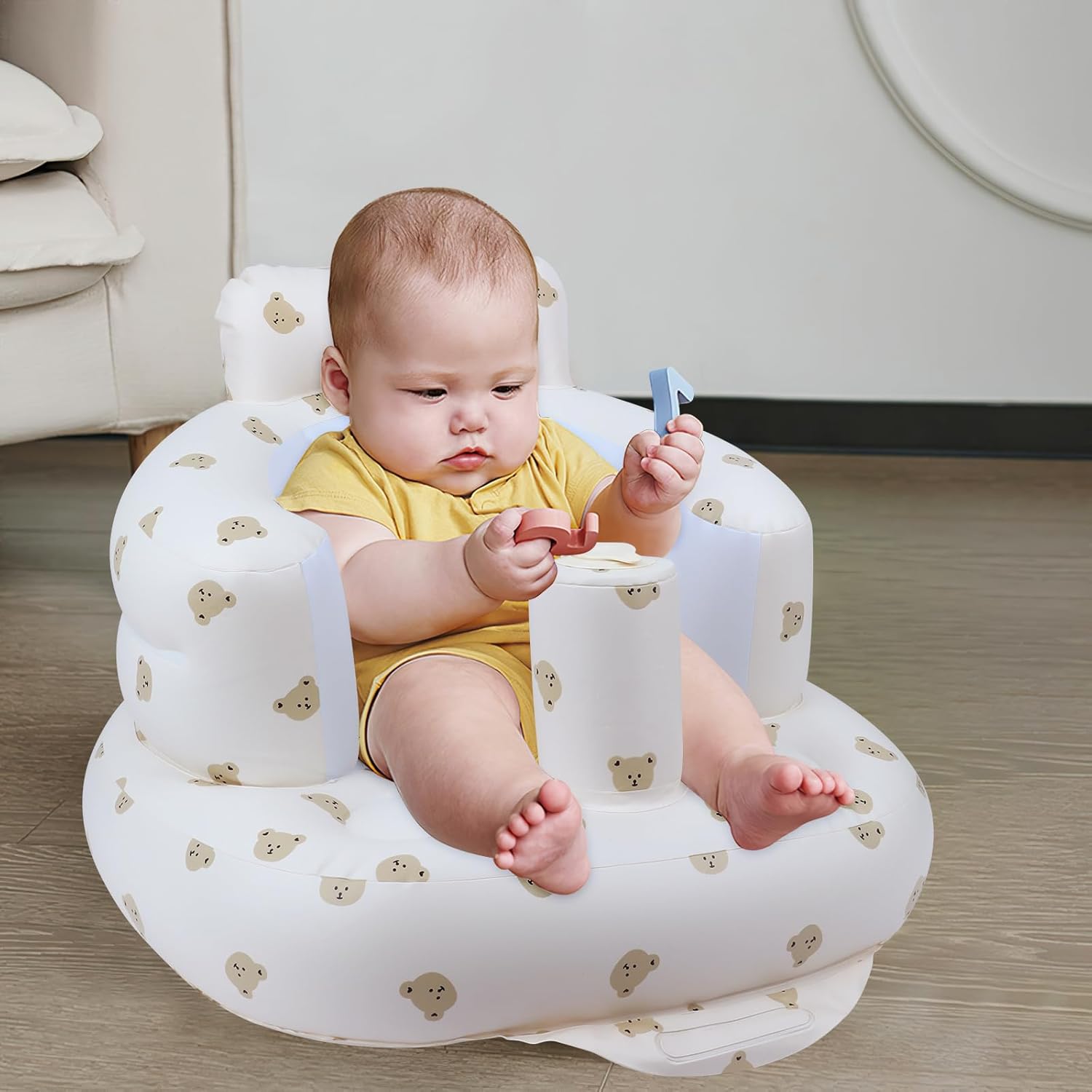 Infant inflatable seat with suction cup and built-in air pump