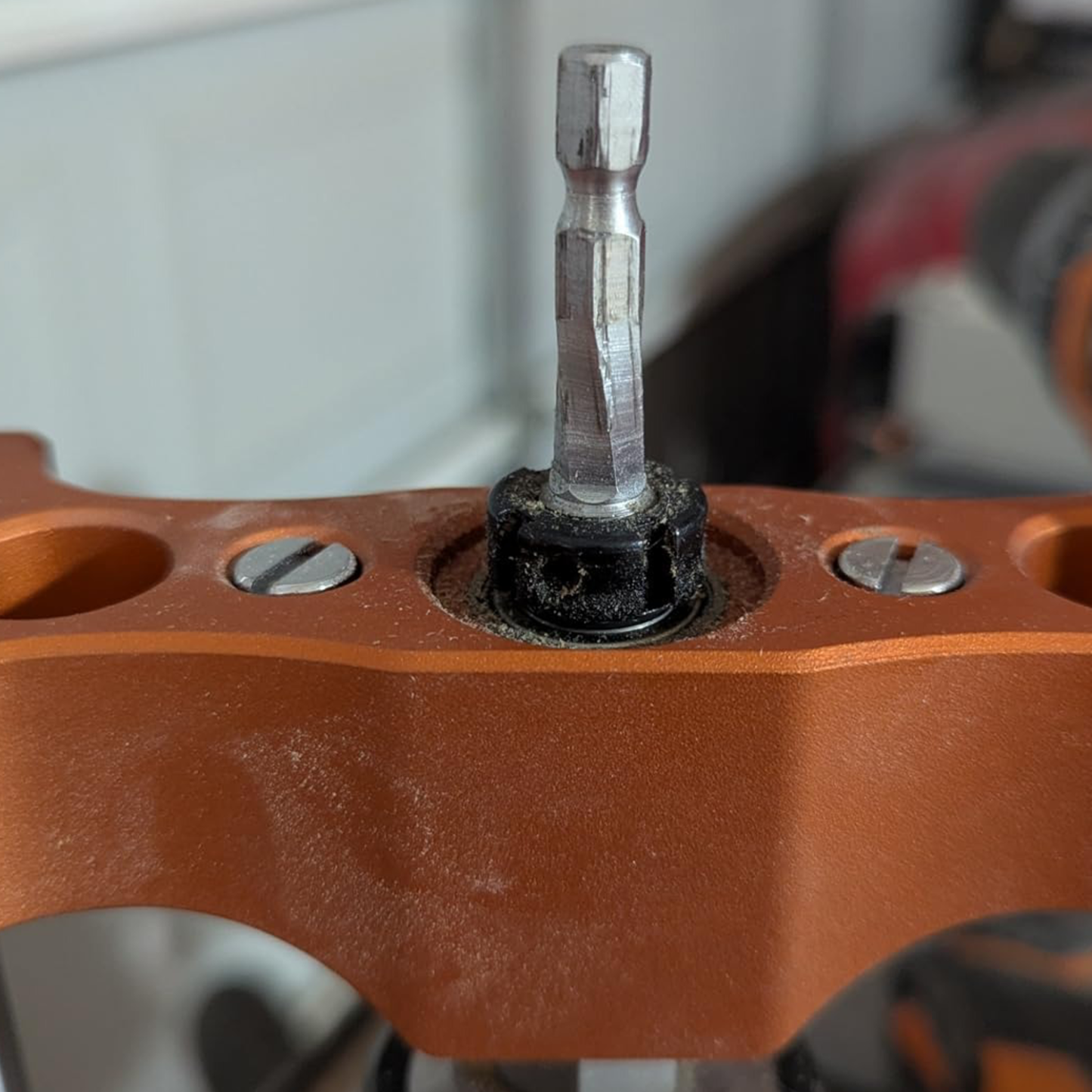 Portable drilling guide with bushed ball bearing guide rod