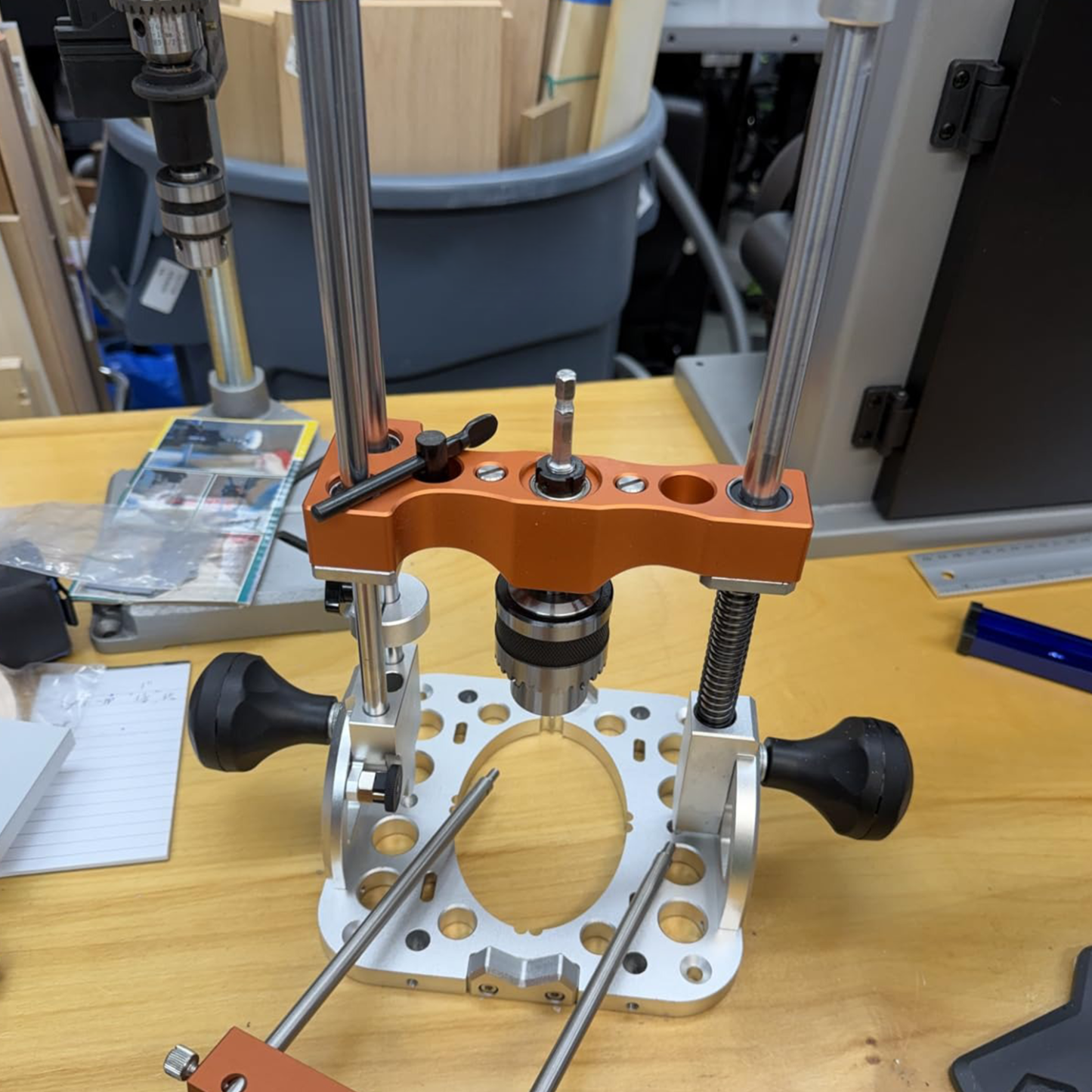 Portable drilling guide with bushed ball bearing guide rod
