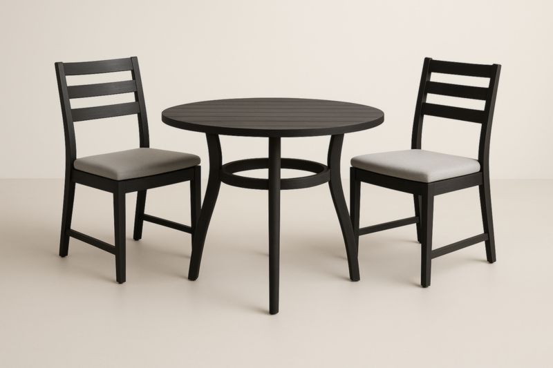 Table ronde en bois noir avec deux chaises coussins gris