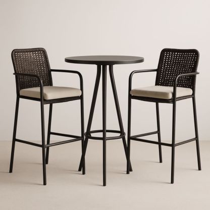 Table de bar ronde noire en aluminium et chaises en rotin synthétique