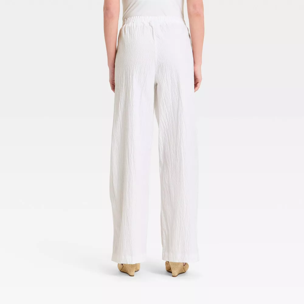 Elegant White Peplum Top & Wide-Leg Pants Set