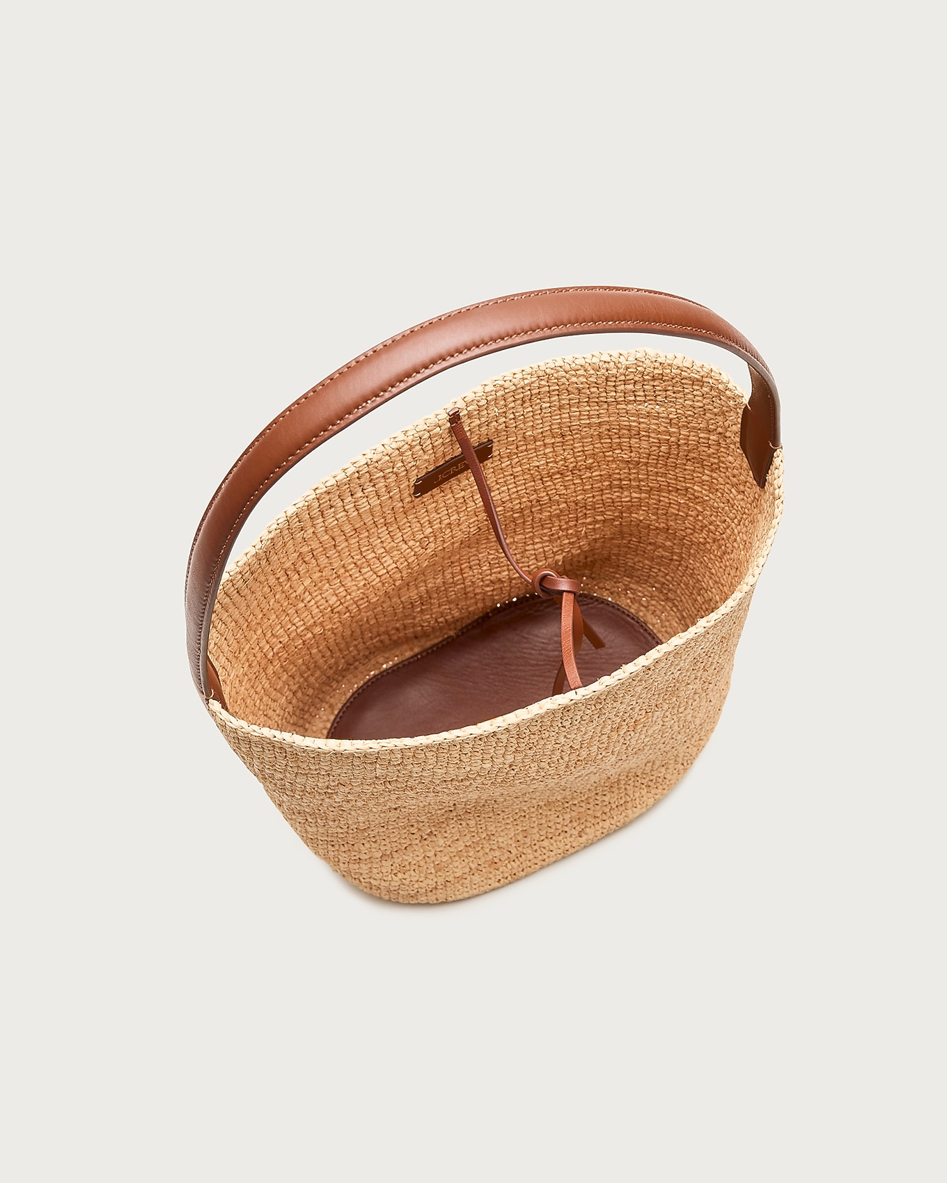 Berkeley handknotted bucket bag in raffia