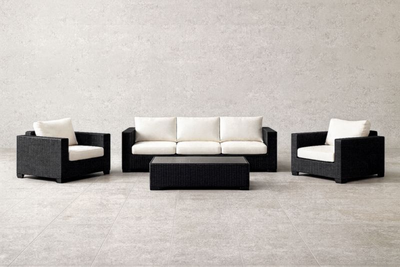 Ensemble de salon extérieur en rotin avec coussins en polyester et table basse en verre