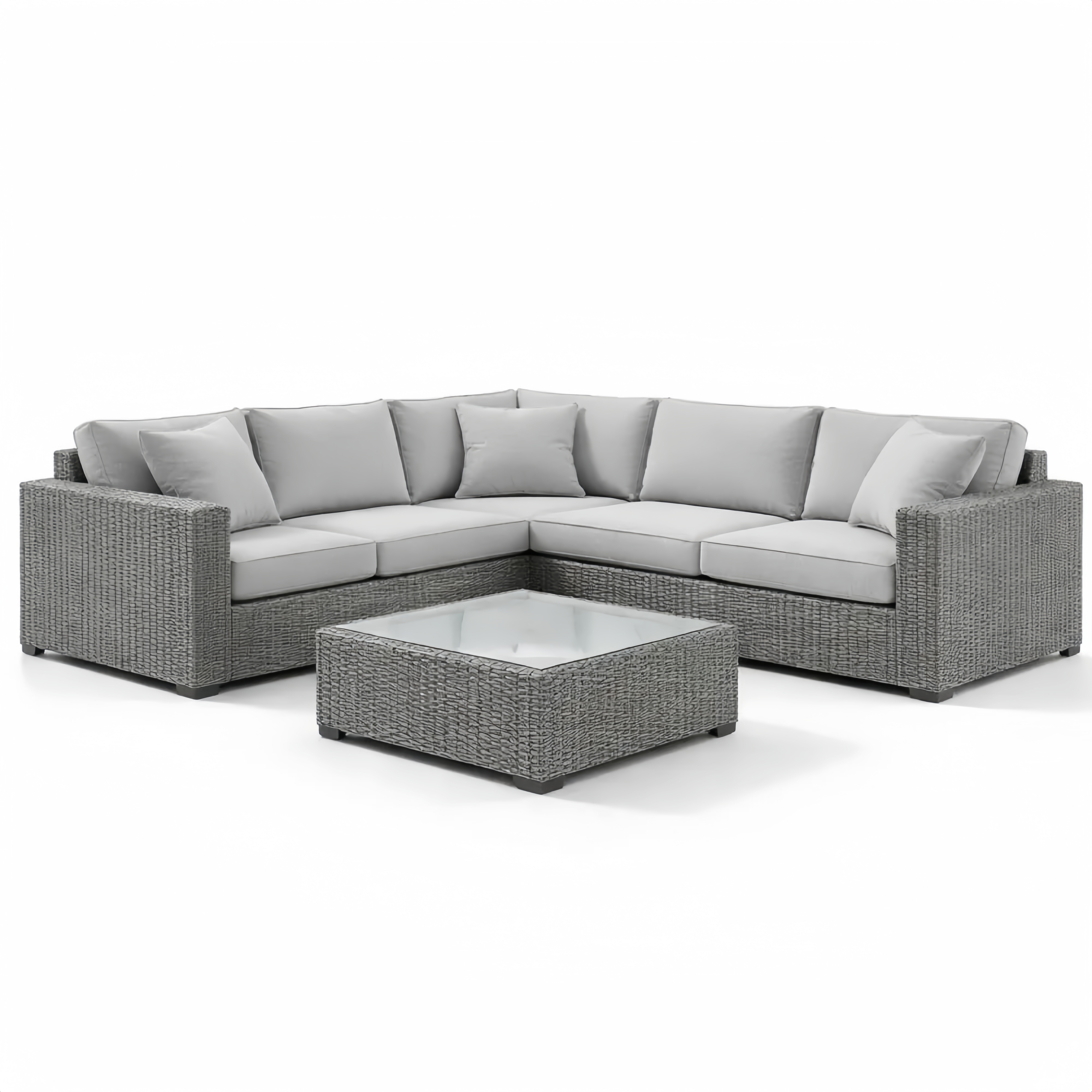 Divano angolare in rattan con tavolino in vetro grigio