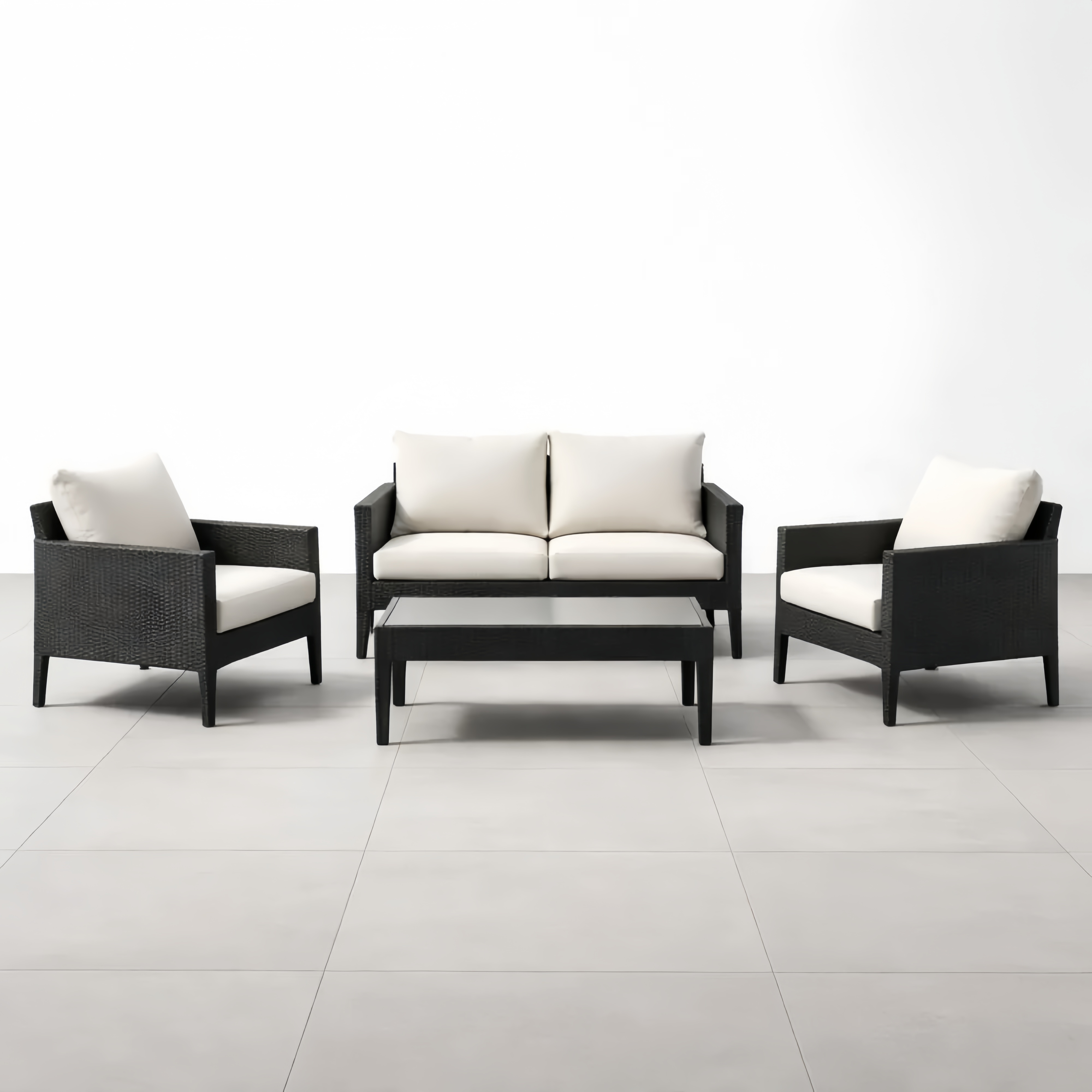 Set mobili da giardino in rattan nero con divano e tavolino cuscini crema