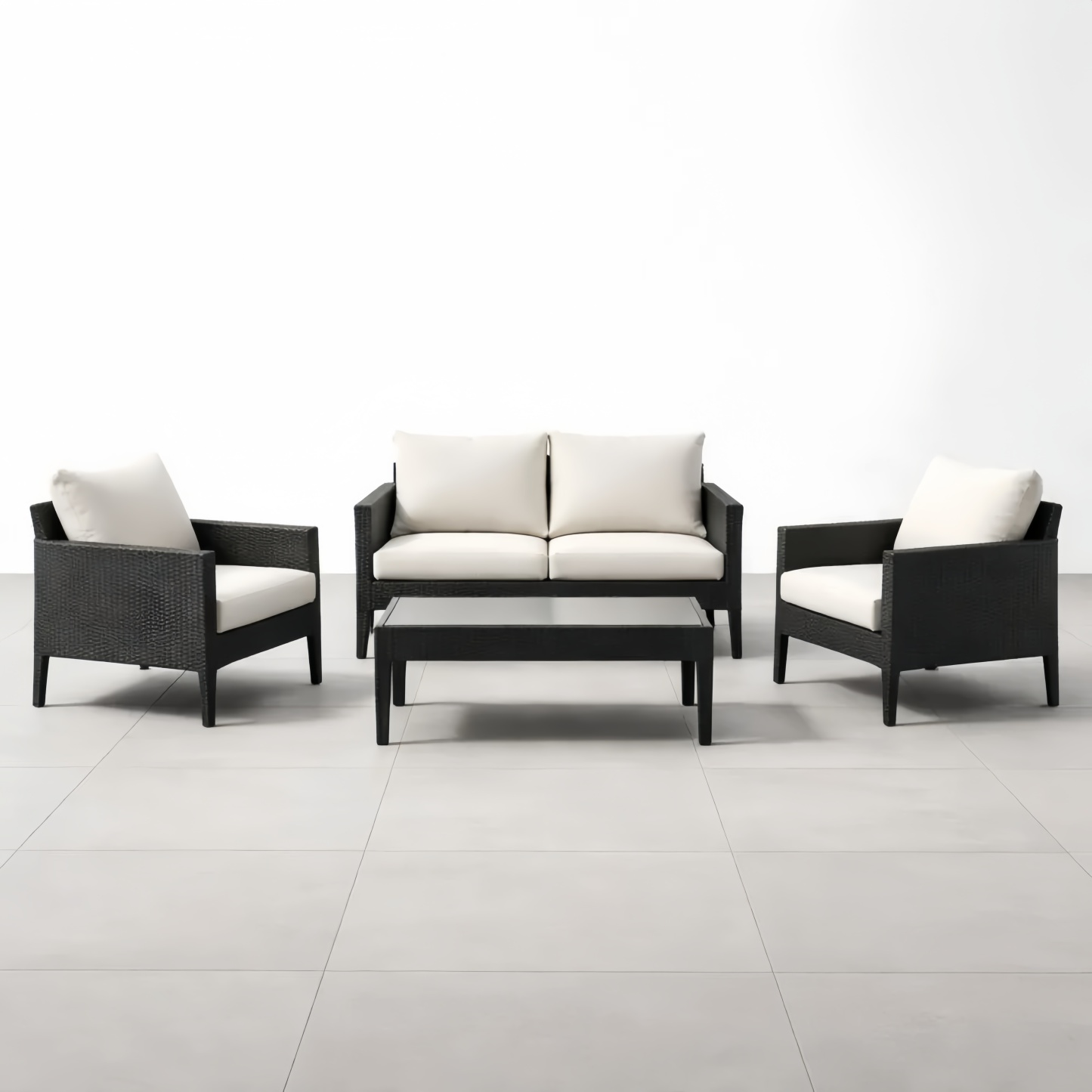 Set mobili da giardino in rattan nero con divano e tavolino cuscini crema