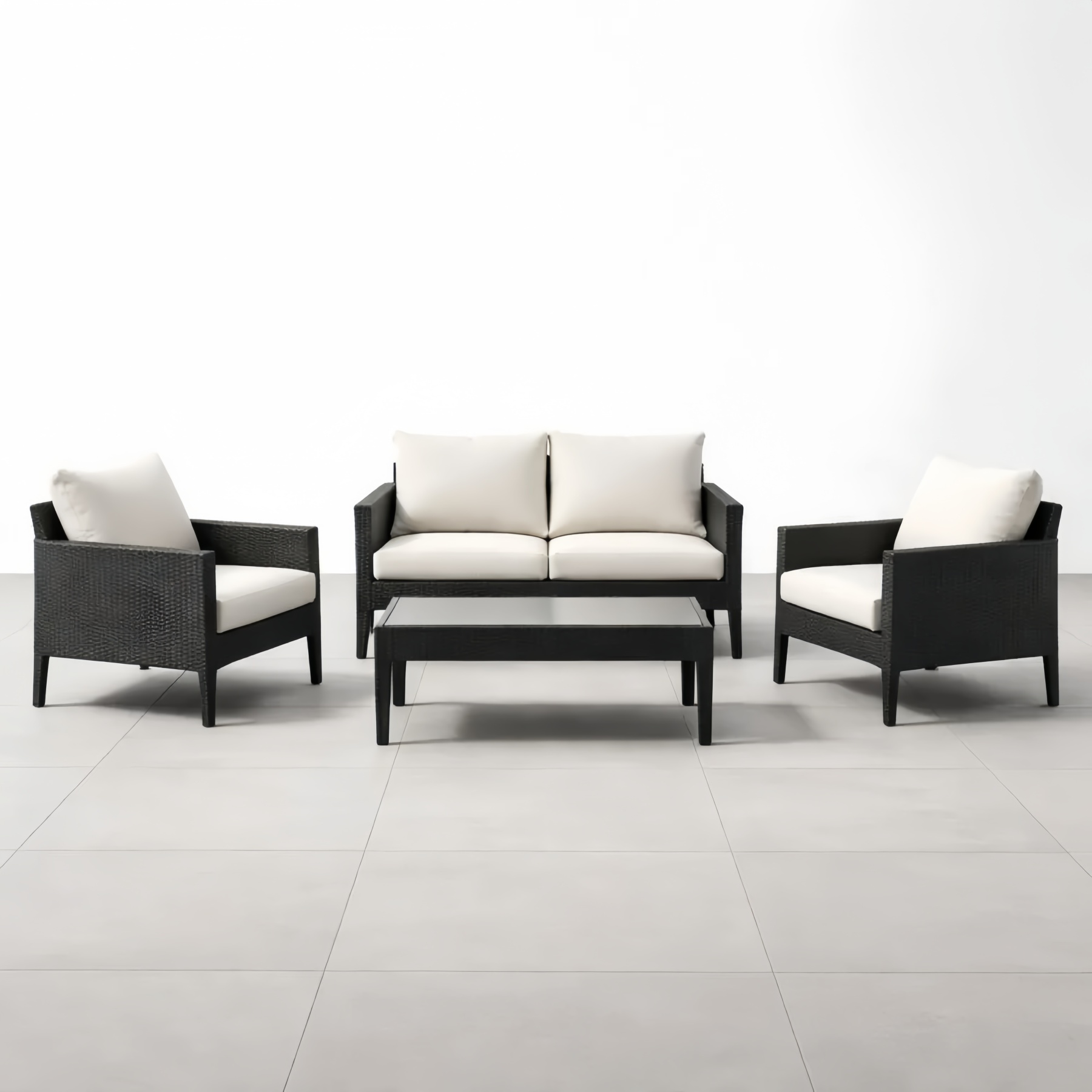 Set mobili da giardino in rattan nero con divano e tavolino cuscini crema