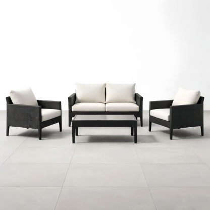 Set mobili da giardino in rattan nero con divano e tavolino cuscini crema