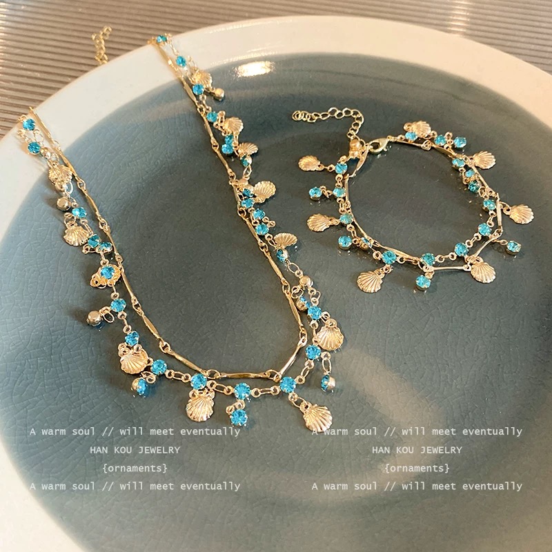 Двуслоен комплект колие и гривна със син циркон и мида