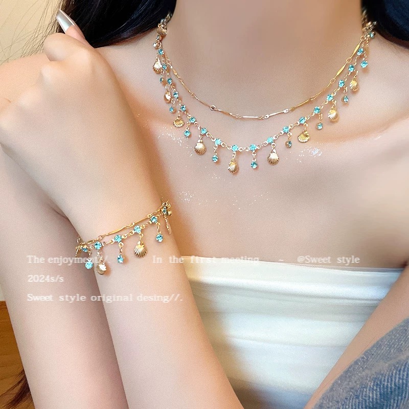 Двуслоен комплект колие и гривна със син циркон и мида