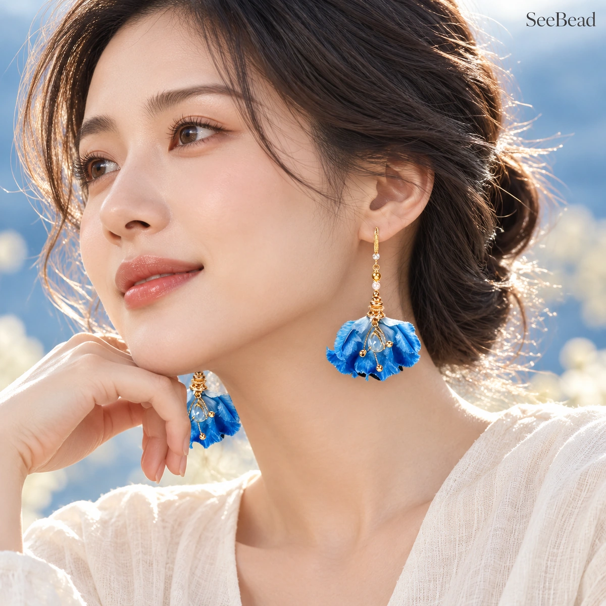 Woman wearing Water Rhythm Iris silk earrings