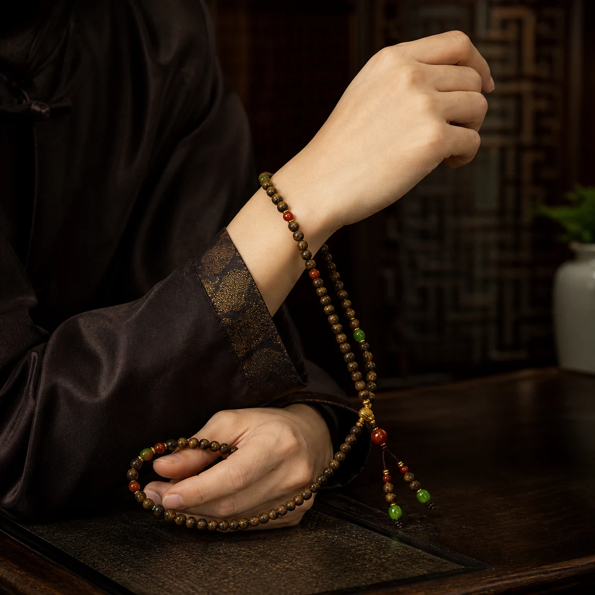 Wood bead strand held in hand