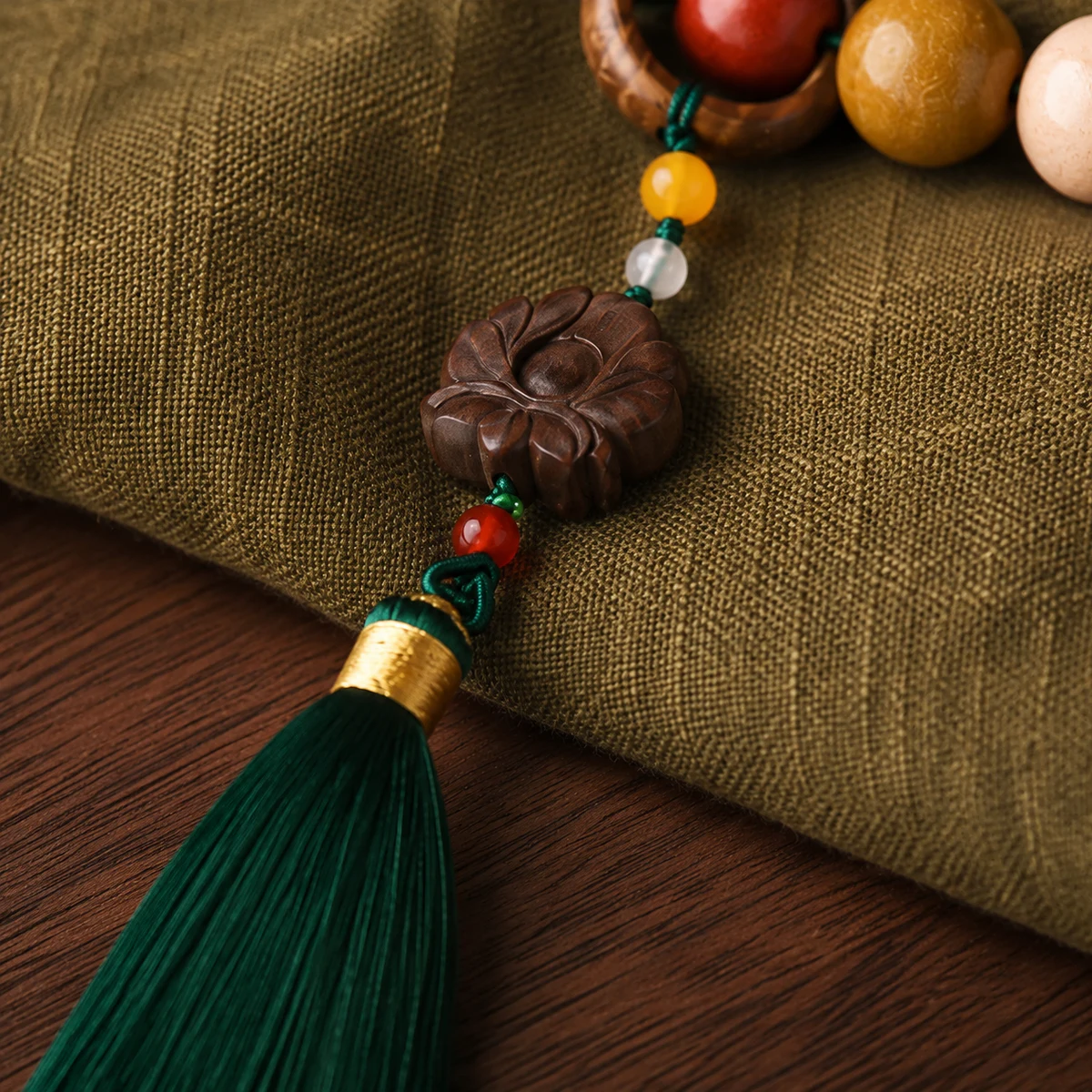 Five-color prayer bead bracelet tassel detail
