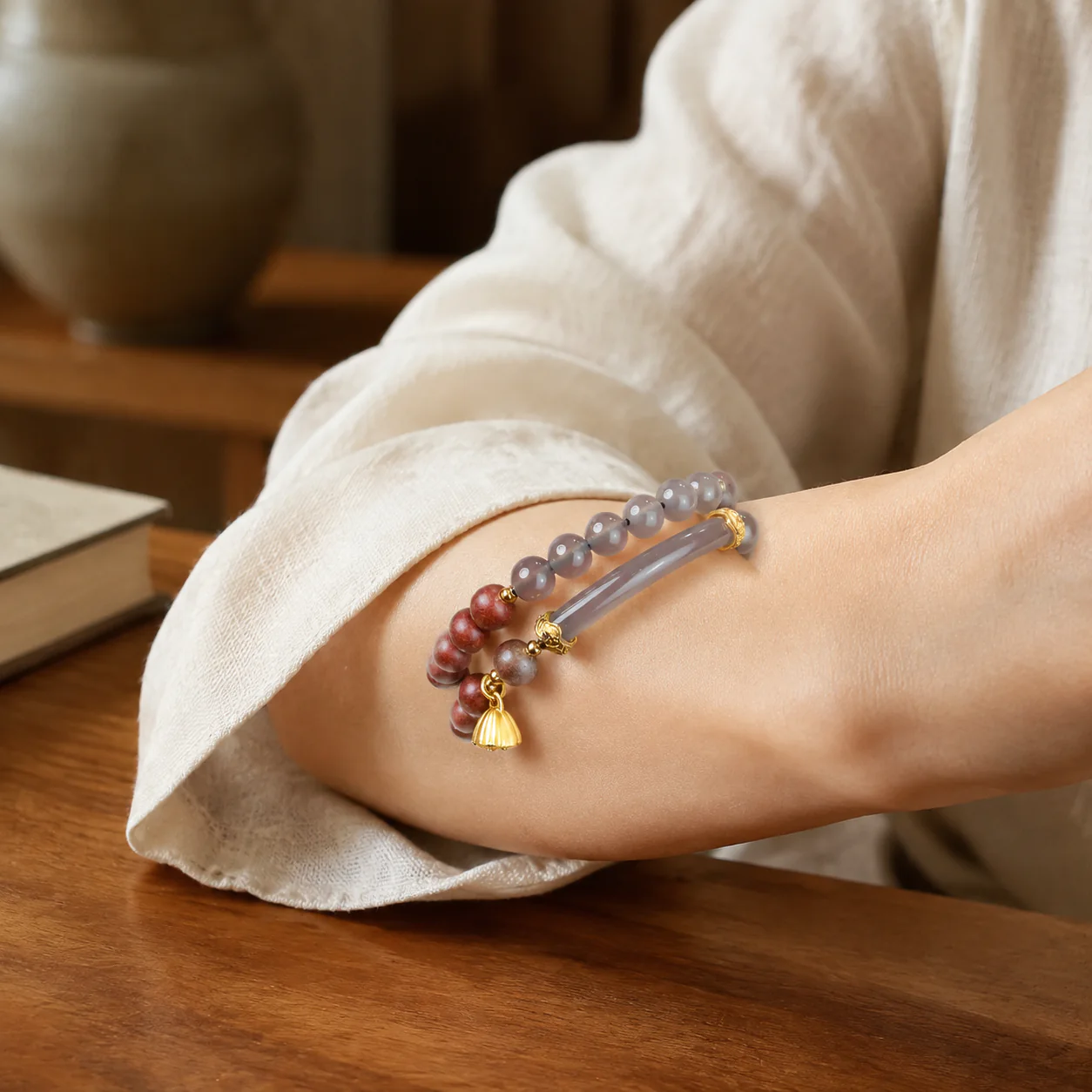 Pink gemstone bead bracelet worn with linen