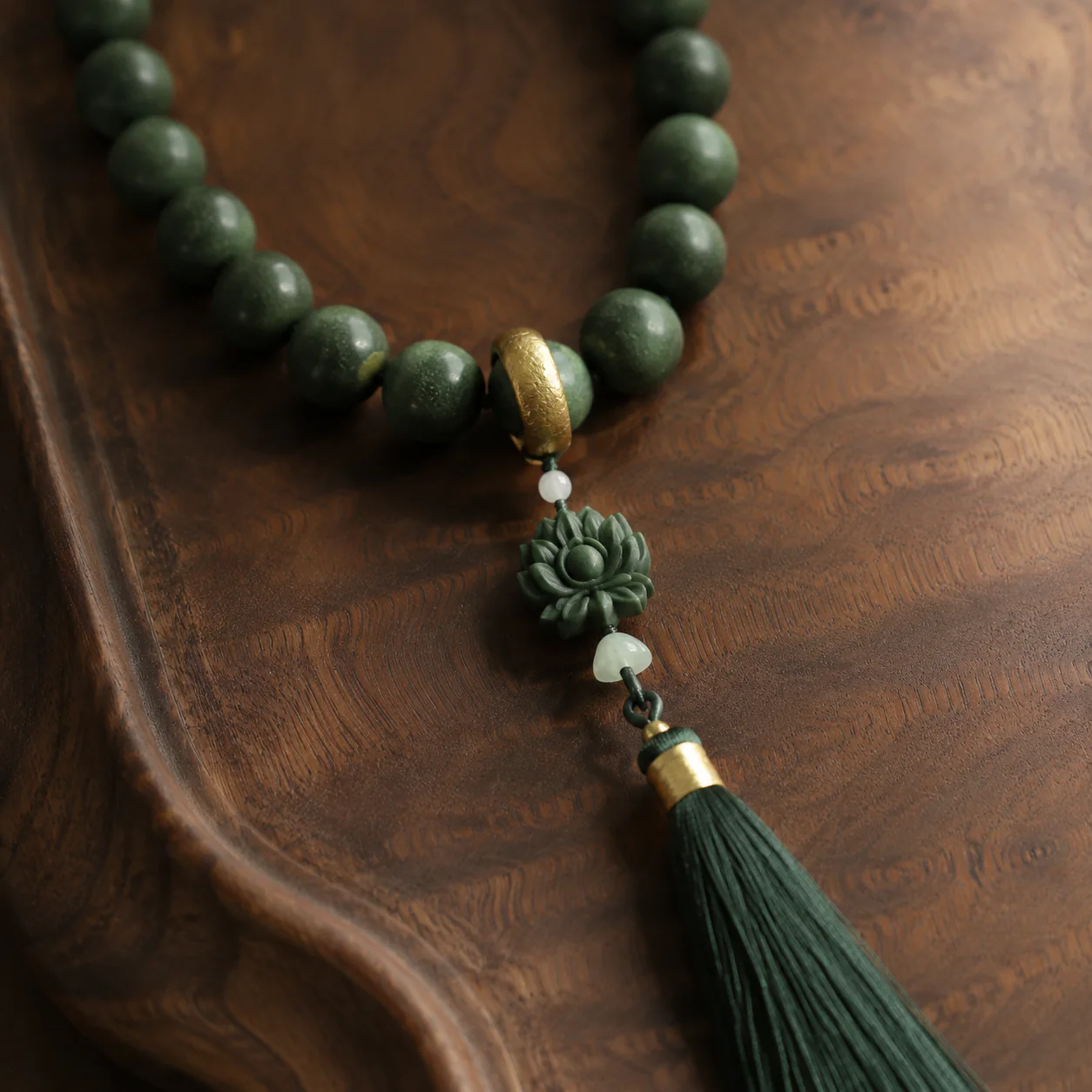 Green incense prayer beads tassel and bead detail