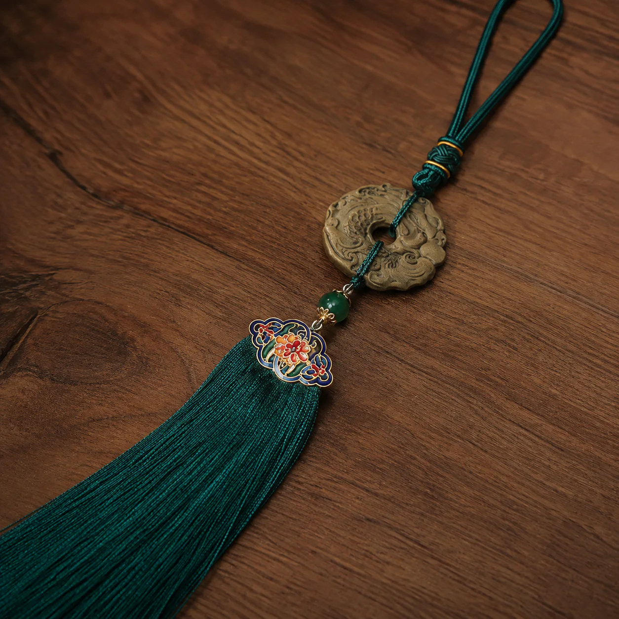 Green tassel hanging ornament floral detail