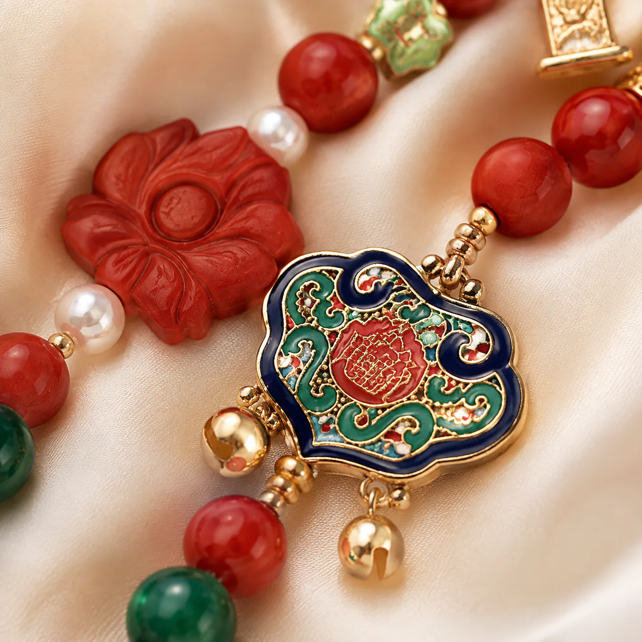 Red bead mala green tassel detail
