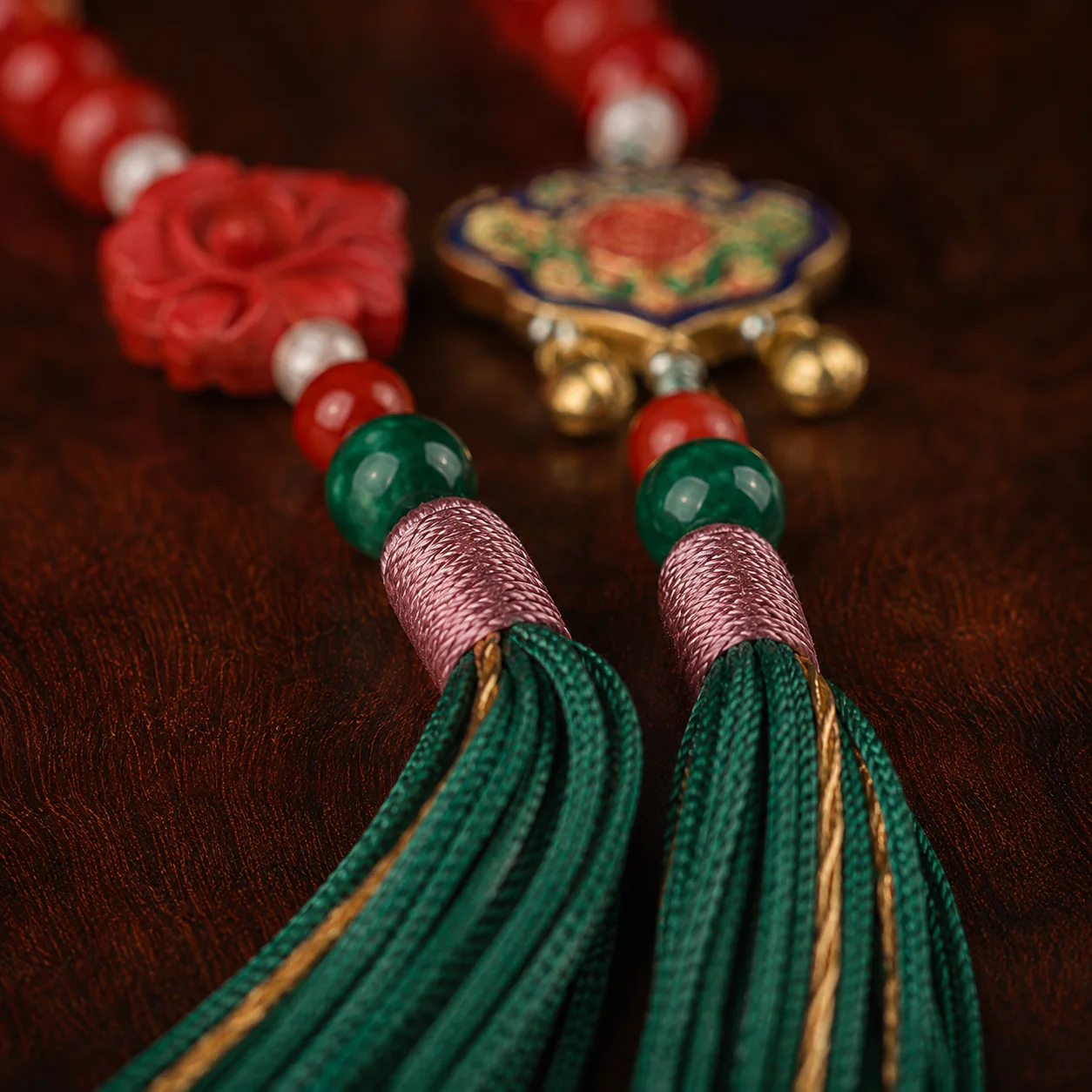 Red bead mala with green tassels gift presentation