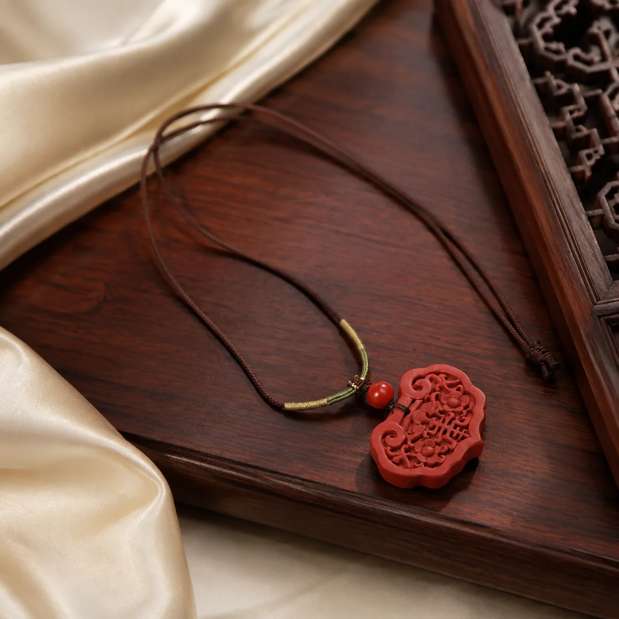 Red carved pendant necklace in a new Chinese setting