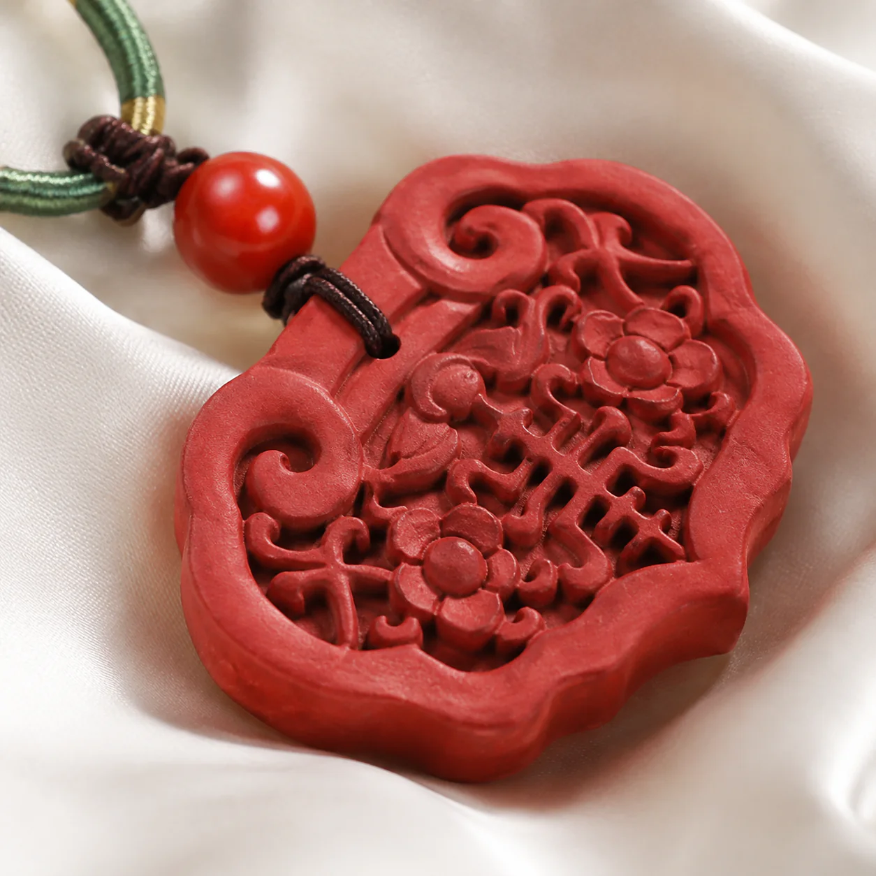 Red carved pendant necklace pendant detail